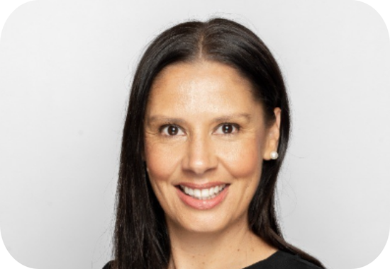 Headshot of Bronwyn Dodd, a woman with long, straight, brown hair, brown skin wearing a black blouse.