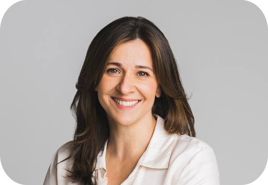 Headshot of Zak Hammer, a woman with long, brown hair and pale skin, who wears a white blouse.