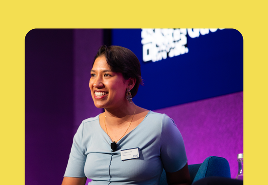Farhana smiling on a panel
